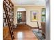 Cozy living room featuring hardwood floors, a rolling library ladder, and an open floor plan at 100 N Gaylord St, Denver, CO 80206