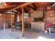 Outdoor kitchen under a covered patio with brick fireplace, grill, and seating area at 100 N Gaylord St, Denver, CO 80206