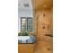 Bathroom showcasing a modern tiled shower with natural light from the window at 100 N Gaylord St, Denver, CO 80206