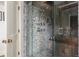 Luxurious shower featuring pebble tile and dual shower heads at 100 N Gaylord St, Denver, CO 80206