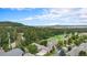Scenic aerial view of the community showcasing lush greenery and mountain views at 1405 Castlepoint Circle, Castle Pines, CO 80108