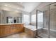 Primary bathroom features a jacuzzi tub, shower and double vanity at 1405 Castlepoint Circle, Castle Pines, CO 80108