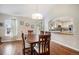 Charming dining area with hardwood floors and an adjacent view of the kitchen at 1405 Castlepoint Circle, Castle Pines, CO 80108