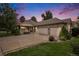 Charming single-Gathering home with a well-manicured front yard and an attached three-car garage at 1405 Castlepoint Circle, Castle Pines, CO 80108