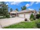 Beautiful home exterior with a charming porch and a spacious three-car attached garage at 1405 Castlepoint Circle, Castle Pines, CO 80108