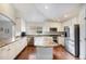 Bright kitchen with stainless steel appliances, granite countertops, and a spacious island at 1405 Castlepoint Circle, Castle Pines, CO 80108