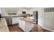 Modern kitchen features granite countertops, stainless steel appliances, and a central island at 1405 Castlepoint Circle, Castle Pines, CO 80108