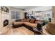 Cozy living room with fireplace, comfortable sofa, and modern finishes at 1405 Castlepoint Circle, Castle Pines, CO 80108