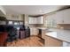 Open concept office and kitchen with ample space for working from home at 1405 Castlepoint Circle, Castle Pines, CO 80108