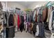 Spacious walk-in closet with ample storage space and shelving units for organization at 1734 Summerglow Ln, Monument, CO 80132
