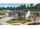 Charming single-story home featuring a three-car garage, solar panels and lush front yard at 1734 Summerglow Ln, Monument, CO 80132