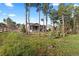 Scenic view of the home from the backyard with mature trees at 1734 Summerglow Ln, Monument, CO 80132