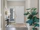 Bright foyer features a white front door and views of the home's exterior at 1734 Summerglow Ln, Monument, CO 80132