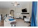 Inviting living space featuring a stone fireplace, comfortable seating and lots of light at 1734 Summerglow Ln, Monument, CO 80132
