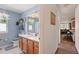Clean bathroom with light blue walls, shower/tub combo, and vanity at 220 S Julian St # C, Denver, CO 80219