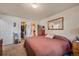 Main bedroom with king-size bed and access to bathroom and closet at 220 S Julian St # C, Denver, CO 80219