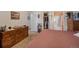 Spacious bedroom with large bed, dresser, and walk-in closet at 220 S Julian St # C, Denver, CO 80219