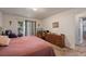Bright bedroom with a queen bed and access to a patio at 220 S Julian St # C, Denver, CO 80219