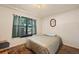 Bedroom with double bed, carpet, and a window with curtains at 220 S Julian St # C, Denver, CO 80219