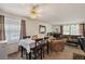 Small dining area with table and four chairs adjacent to living room at 220 S Julian St # C, Denver, CO 80219
