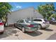Rear exterior view showing parking area and neighboring homes at 220 S Julian St # C, Denver, CO 80219