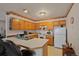 Efficient kitchen with ample counter space and wood cabinets at 220 S Julian St # C, Denver, CO 80219