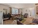 Living room with comfy seating and large window at 220 S Julian St # C, Denver, CO 80219