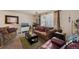 Cozy living room featuring a couch, armchair, and coffee table at 220 S Julian St # C, Denver, CO 80219