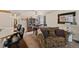 Living room with a view into dining area and kitchen at 220 S Julian St # C, Denver, CO 80219