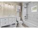 Updated bathroom with shower-tub, white vanity, and neutral walls at 24 Ski Pole Ct, Breckenridge, CO 80424