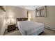 Bedroom with a bed flanked by wooden nightstands and a bright window adding character at 24 Ski Pole Ct, Breckenridge, CO 80424