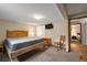 Comfortable bedroom with wood furnishings, mounted television, and neutral color scheme at 24 Ski Pole Ct, Breckenridge, CO 80424