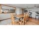 Spacious dining area with a rustic wood table, chairs, and a pass-through to the kitchen, great for gatherings at 24 Ski Pole Ct, Breckenridge, CO 80424