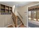 Entryway featuring tiled flooring, staircase, and coat rack with a view of the outdoors at 24 Ski Pole Ct, Breckenridge, CO 80424