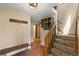Inviting entryway with tiled flooring, a wooden bench, and a staircase leading to the upper level at 24 Ski Pole Ct, Breckenridge, CO 80424