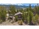 Charming mountain home surrounded by lush green trees with beautiful mountain views at 24 Ski Pole Ct, Breckenridge, CO 80424