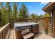 Hot tub on a wooden deck with lattice surround, perfect for relaxation and privacy at 24 Ski Pole Ct, Breckenridge, CO 80424