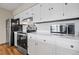 Bright kitchen with stainless steel appliances, white cabinetry, and light countertop space at 24 Ski Pole Ct, Breckenridge, CO 80424