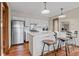 Modern kitchen featuring stainless steel appliances, sleek countertops, and a breakfast bar with stylish stools at 24 Ski Pole Ct, Breckenridge, CO 80424