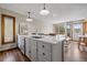 Bright kitchen with a large island, stainless steel appliances, white countertops and modern fixtures at 24 Ski Pole Ct, Breckenridge, CO 80424