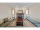 Inviting living area features custom built in seating and a brick fireplace at 24 Ski Pole Ct, Breckenridge, CO 80424