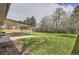 Large backyard includes covered patio and mature trees at 3576 S Holly St, Denver, CO 80237