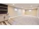 Spacious finished basement with wet bar, carpet and recessed lighting at 3576 S Holly St, Denver, CO 80237