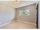 Inviting bedroom with neutral tones, hardwood floors and a well-lit window at 3576 S Holly St, Denver, CO 80237