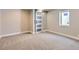 Finished basement bedroom with gray carpet and barn door at 3576 S Holly St, Denver, CO 80237