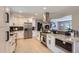 Spacious kitchen with stainless steel appliances, granite counters, and direct view into living room at 3576 S Holly St, Denver, CO 80237