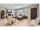 Inviting living room with large window, fireplace, neutral color palette, and hardwood floors at 3576 S Holly St, Denver, CO 80237