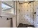 Stylish shower with geometric tile design and black fixtures for a sleek look at 3576 S Holly St, Denver, CO 80237