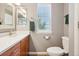 Updated bathroom features a modern vanity and updated fixtures with a green accent at 2933 Central Park Blvd, Denver, CO 80238