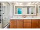 Bathroom featuring double sinks, generous countertop space, and a shower-tub combo at 2933 Central Park Blvd, Denver, CO 80238